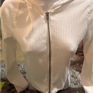 White zip up w hood.